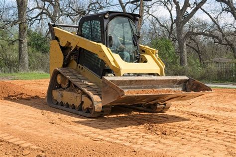 how to level ground with a skid steer without digging|grade with a skid steer.